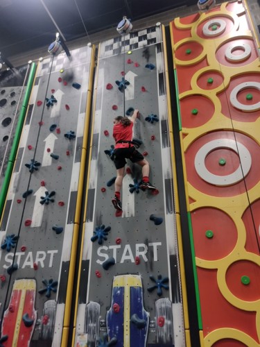 a child on a climbing wall