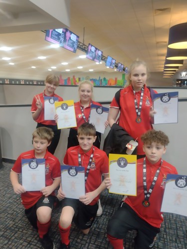 children holding certificates